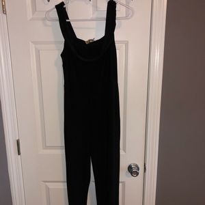 Black romper with ruffle neck
